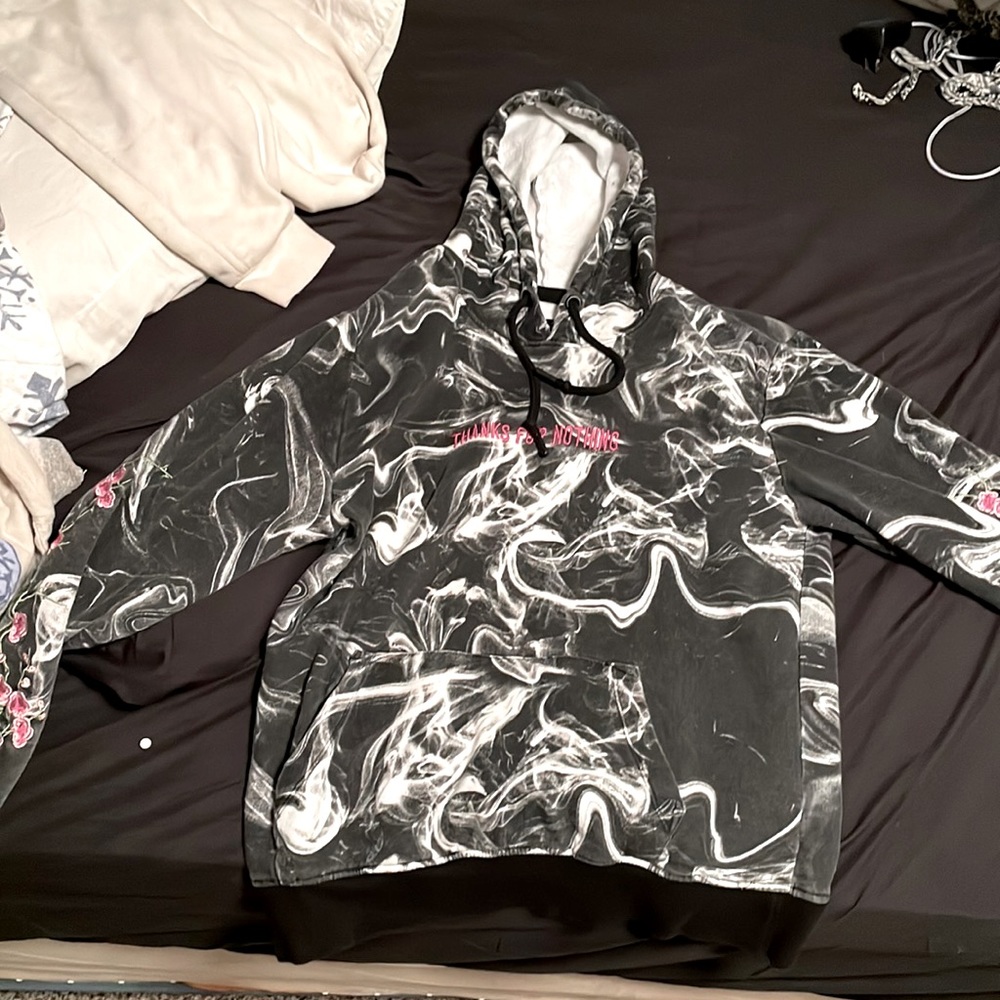 Black and white hoodie with pink letters and flowers, size medium. from rue21.